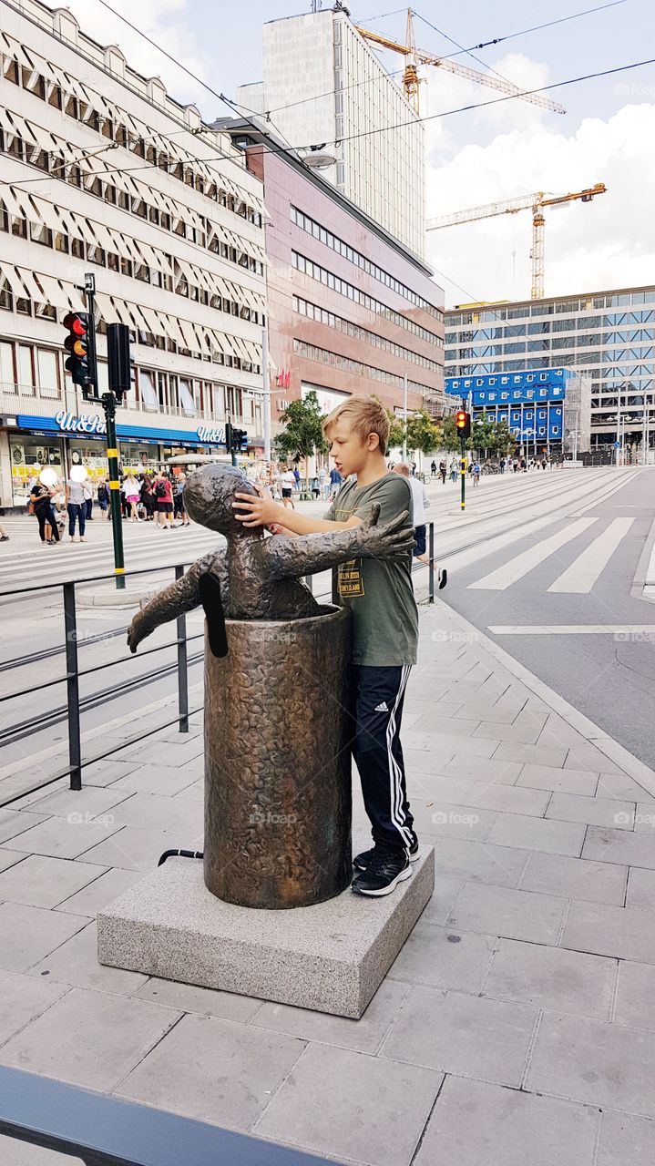 Stockholm Sweden, boy with statue