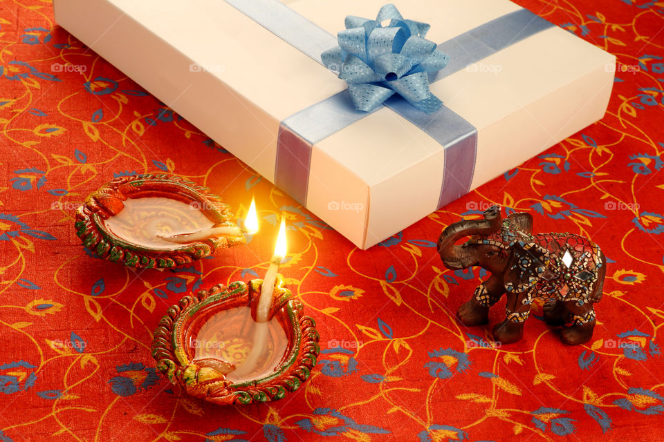 Indian festival Diwali diya with gift box