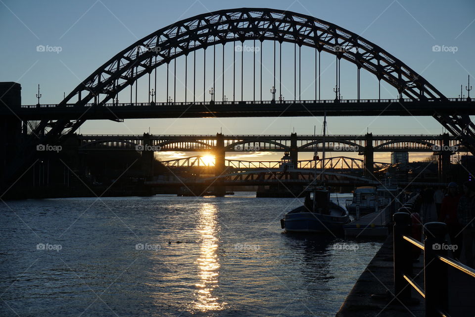 Sunset Over The Tyne ... beautiful golden setting sun lighting up the water as it peeps between the bridges 