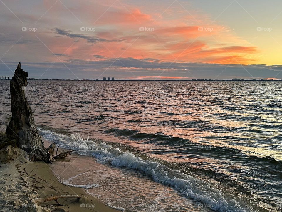 The sun came out of its abode across the brilliant orange horizon and glimmered in the sky. The sparkling sun started slowly rising up the scarlet skyline, which clearly differentiated the sky and the land.