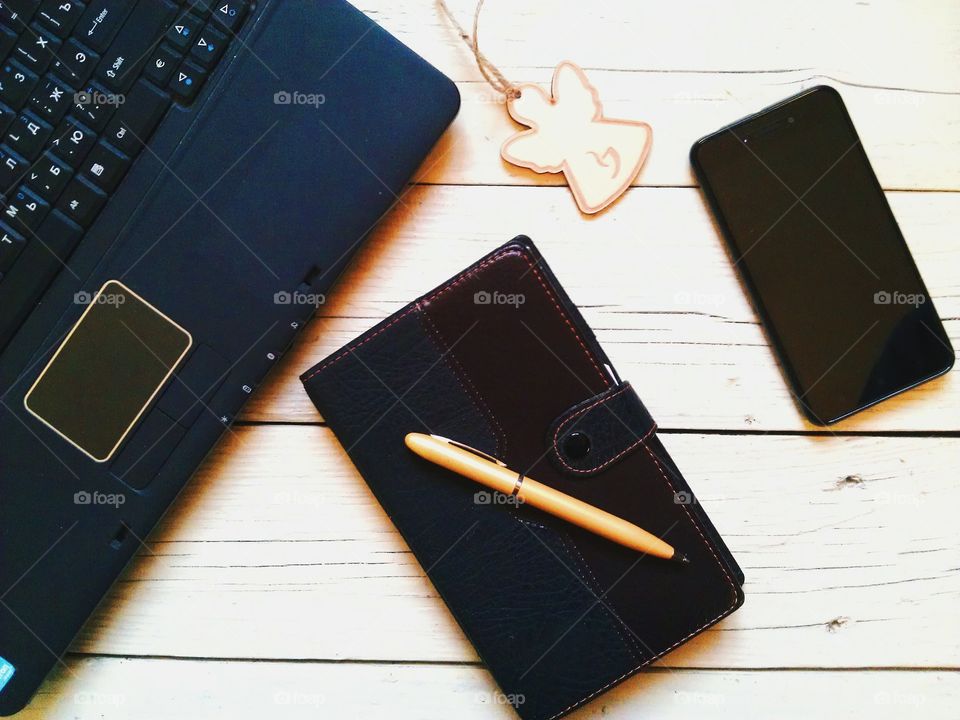 notebook, pen, organizer, a smartphone on the desktop