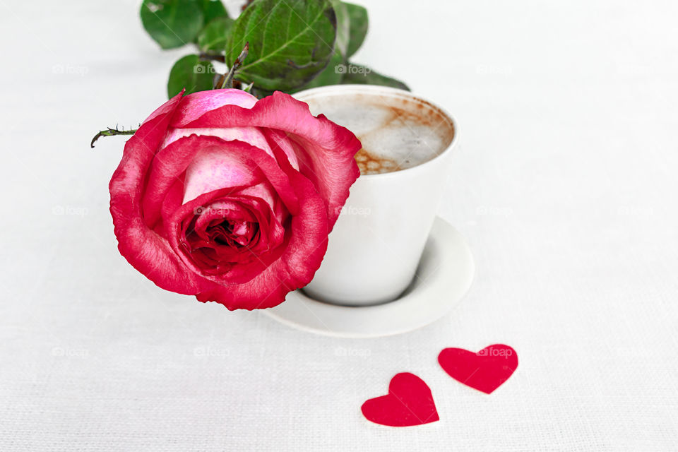 rose and cup of coffee