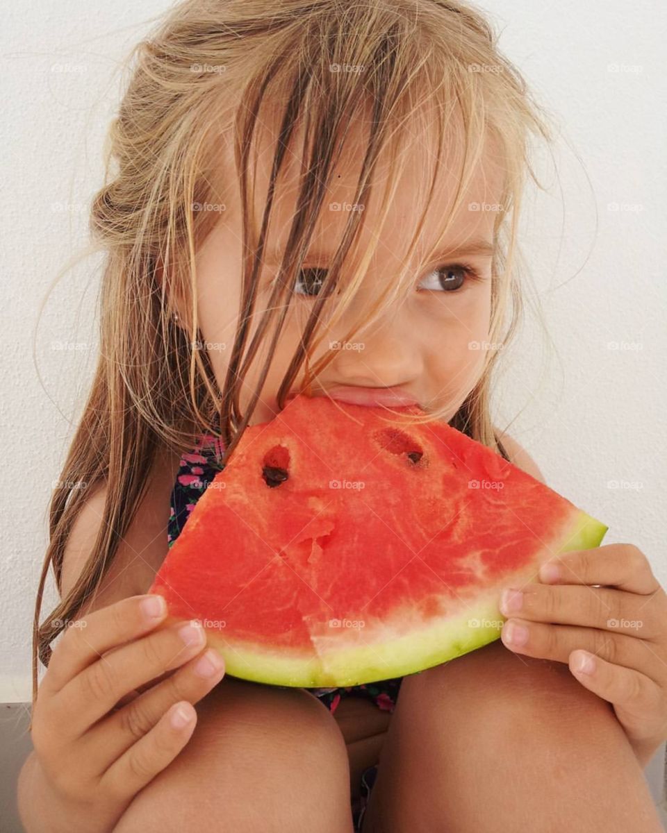 Child eating watermelon
