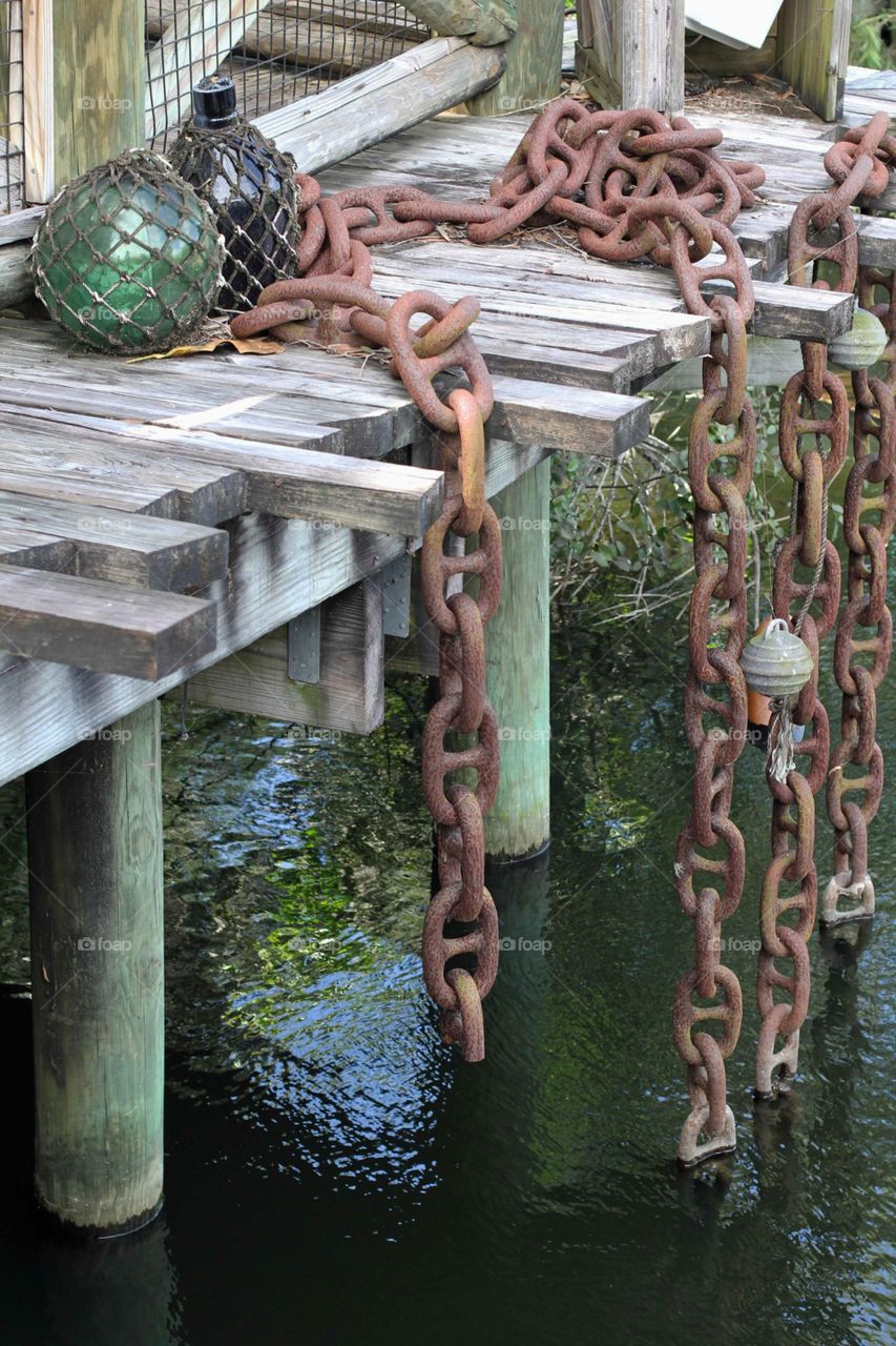 Rusty chain on pier