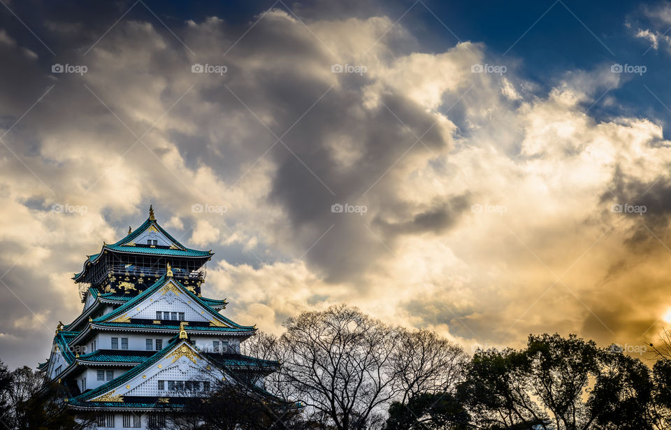 Osaka Castle and dramatic cloudscape.