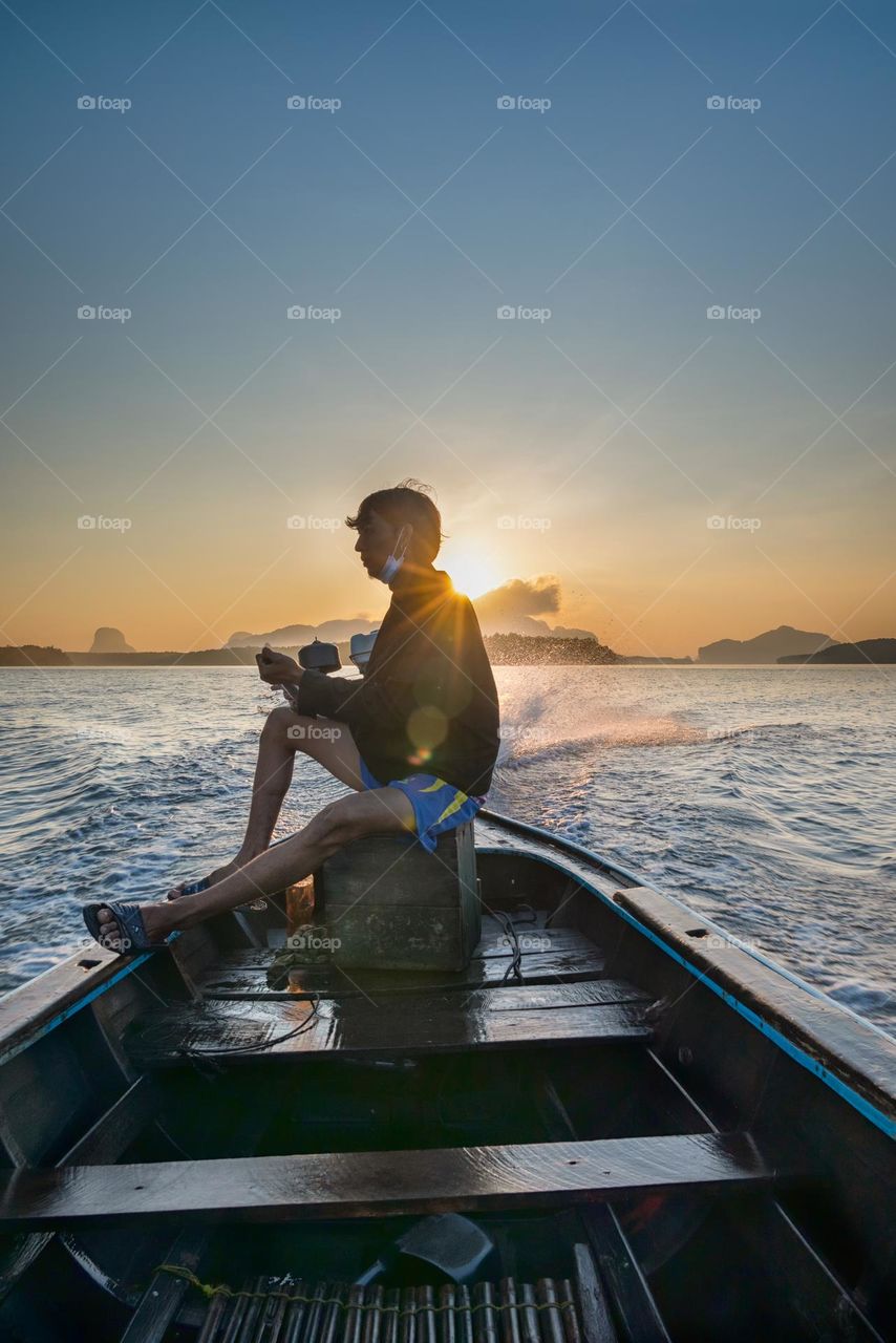 Sailing boat in beuatiful sunrise moment