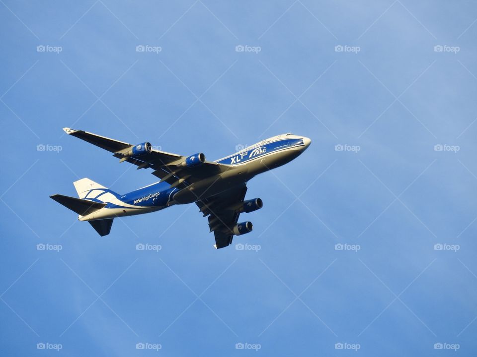 Airplane in blue sky 