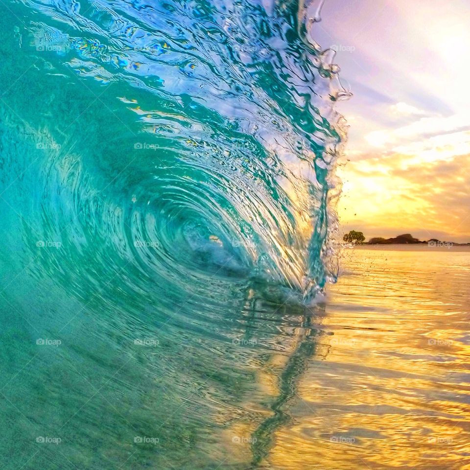 Sunrise glow. Sunrise on an empty beach in Hawaii 