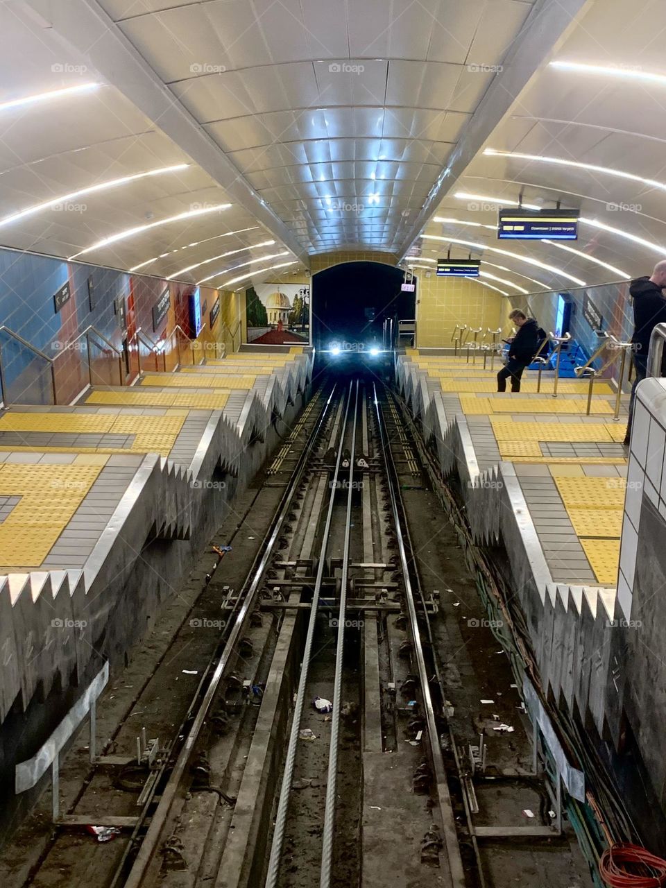 Funicular lights in the tunnel arrive to station