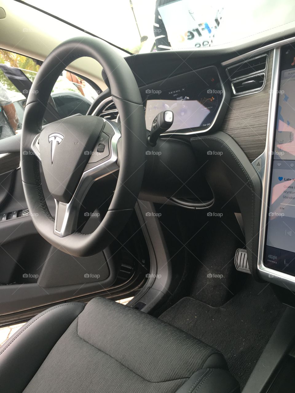 Steering wheel of black tesla located at the University of Central Florida.