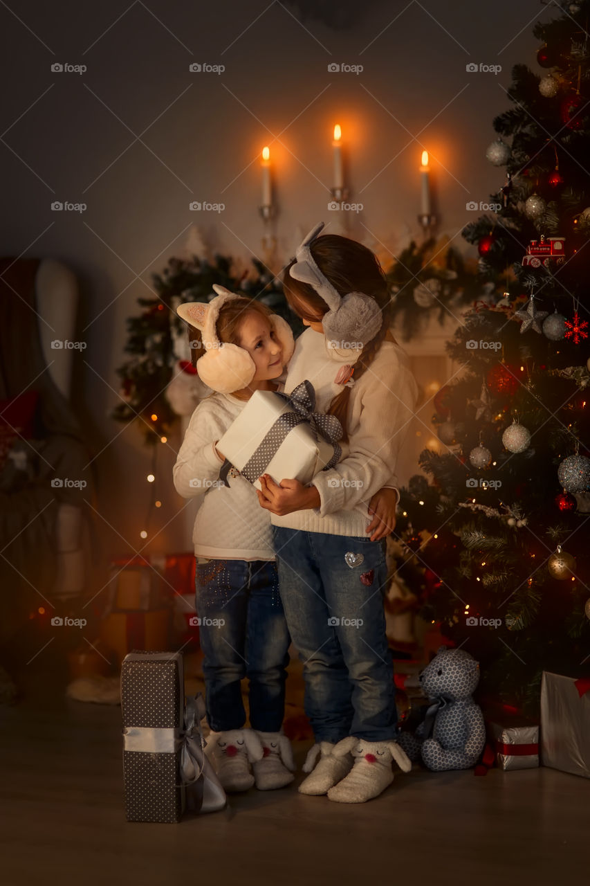 Cute little Sisters at Christmas Eve 