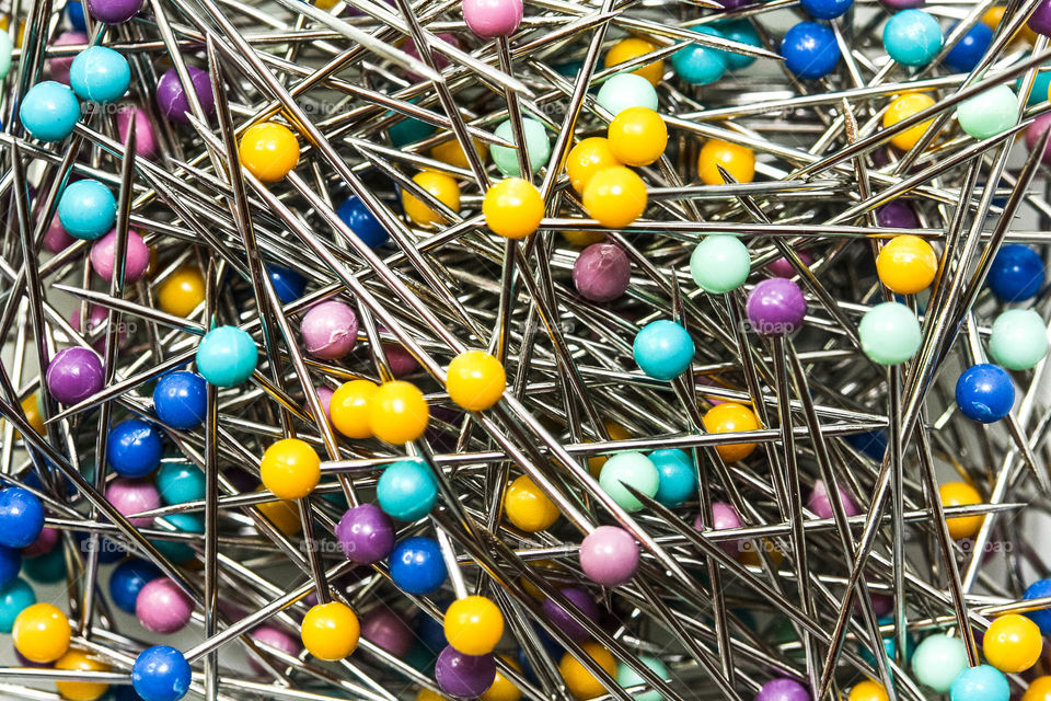 Background full of metal sewing pins