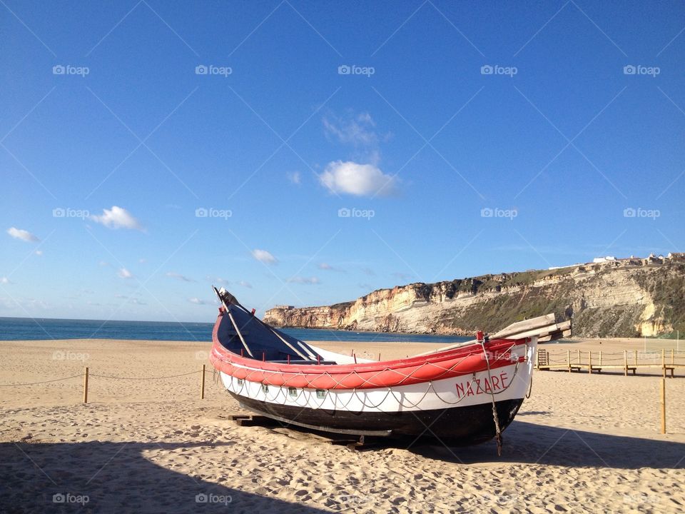 Fisher's boat, sand, Nazaré, Portugal 