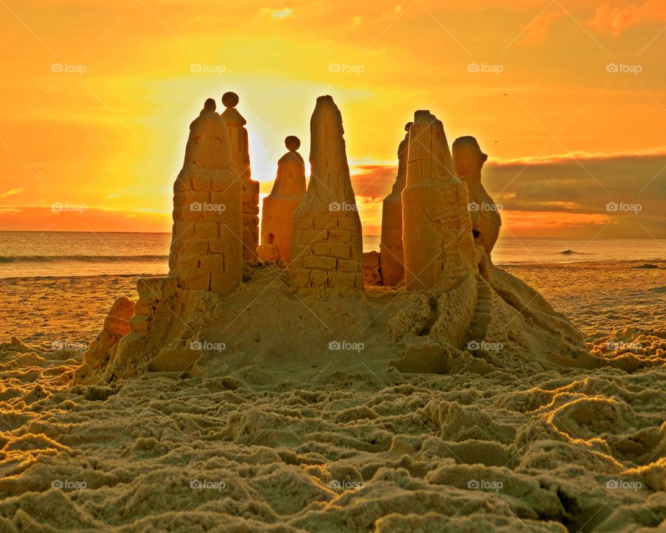 It took millions of grains of sand to build this sandcastle and I absolutely loved witnessing the sunset descend behind it