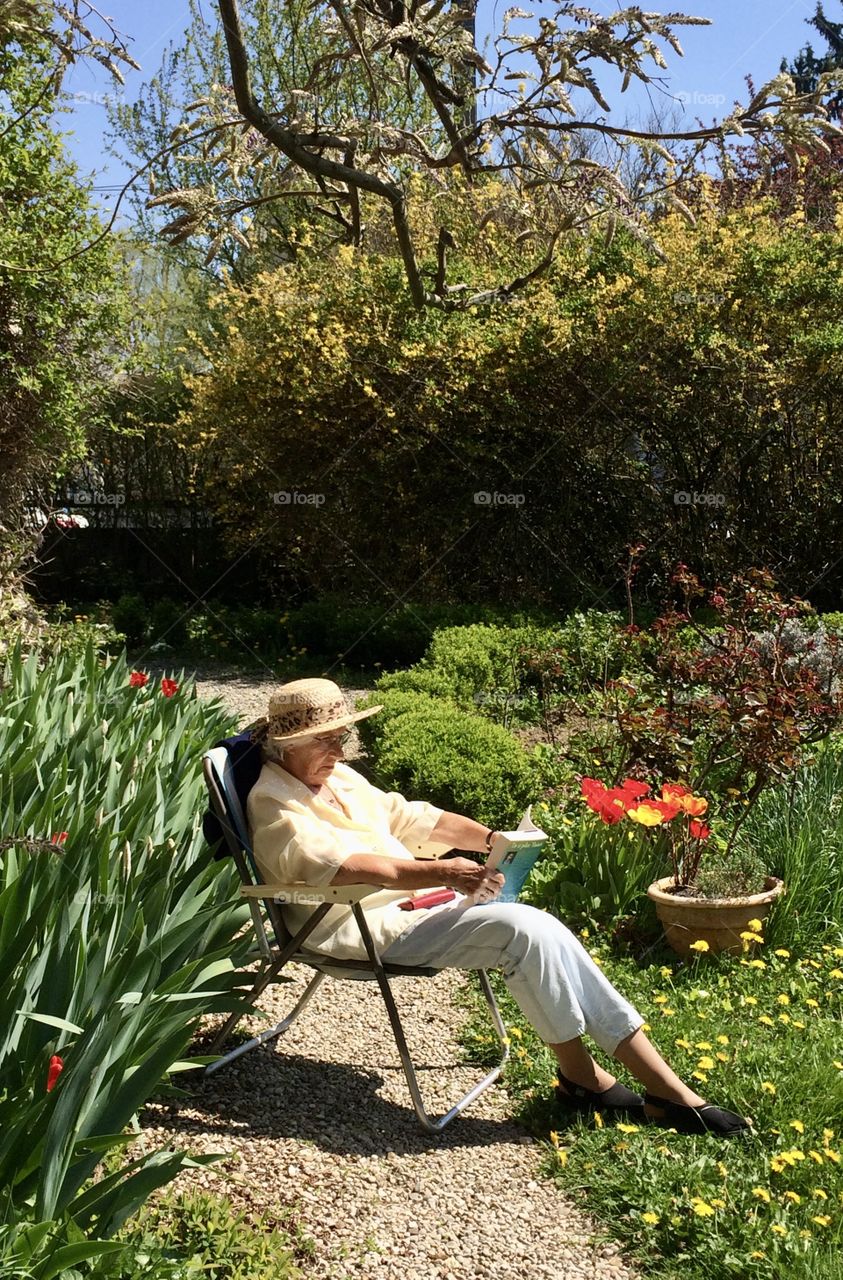 Grandma reading in garden