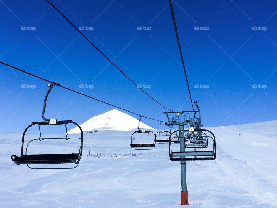 Empty ski lifts on a clear blue sky day