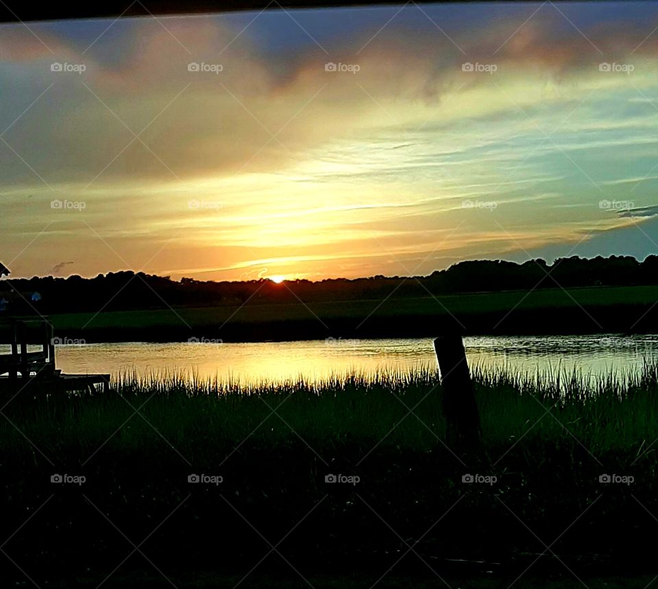 cloudy sunset over the salt marsh