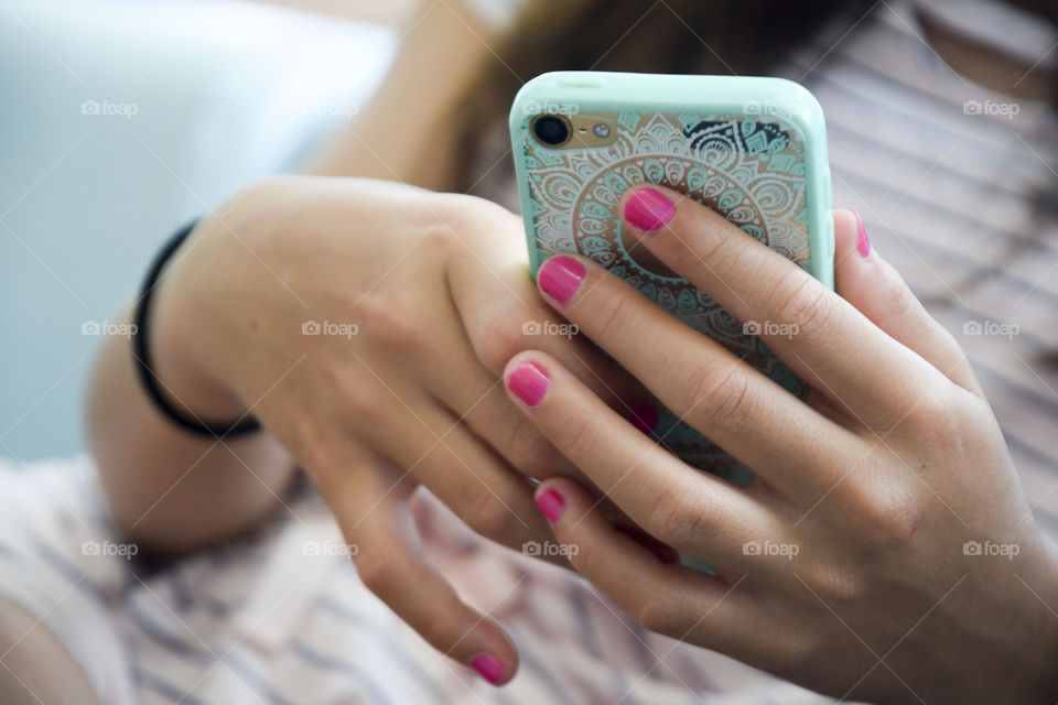 Girl holding her Mobil phone