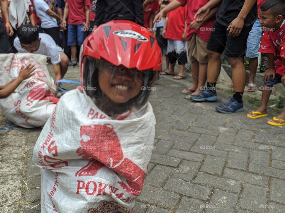 His grin revealed his teeth inside the helmet