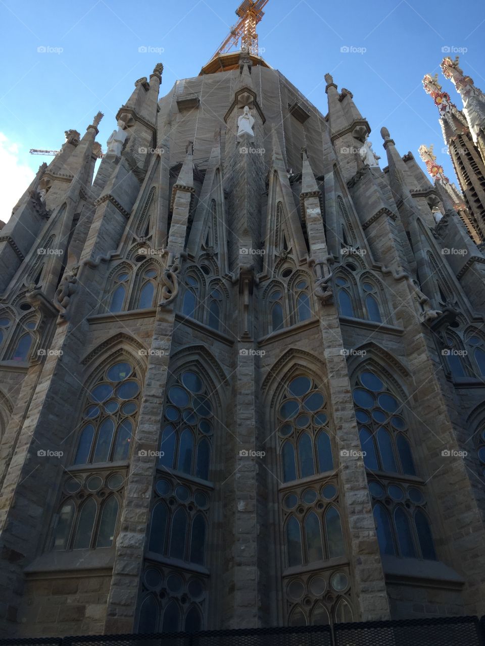 Side view with interesting windows of the Basilica de la Sagrada Familia