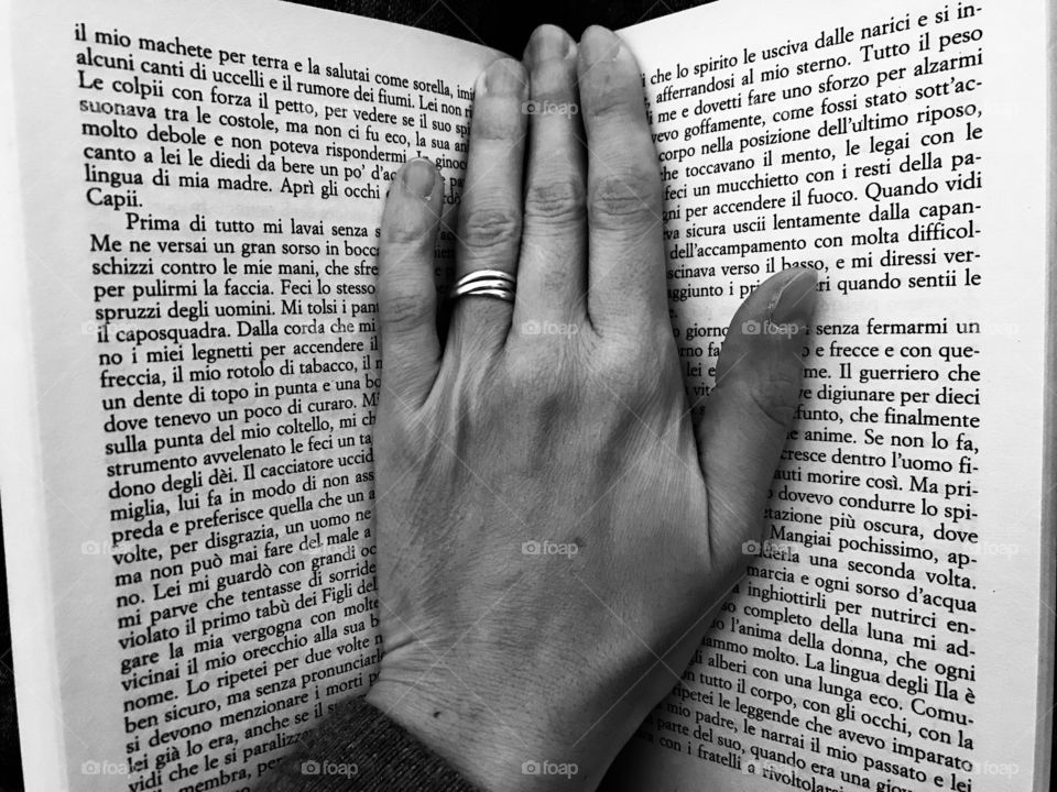 Hand on a book