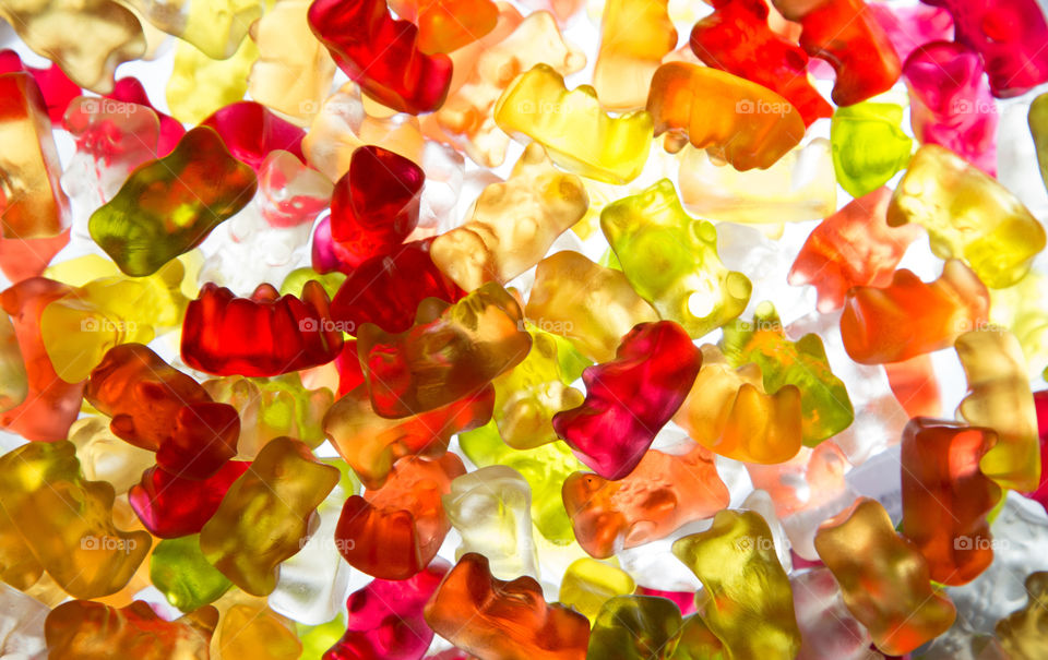 Color mix of Gummy bears on Illuminated background 
