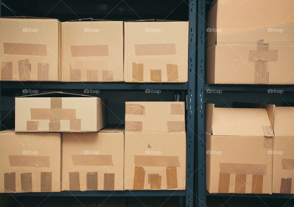 Cardboard boxes on shelves
