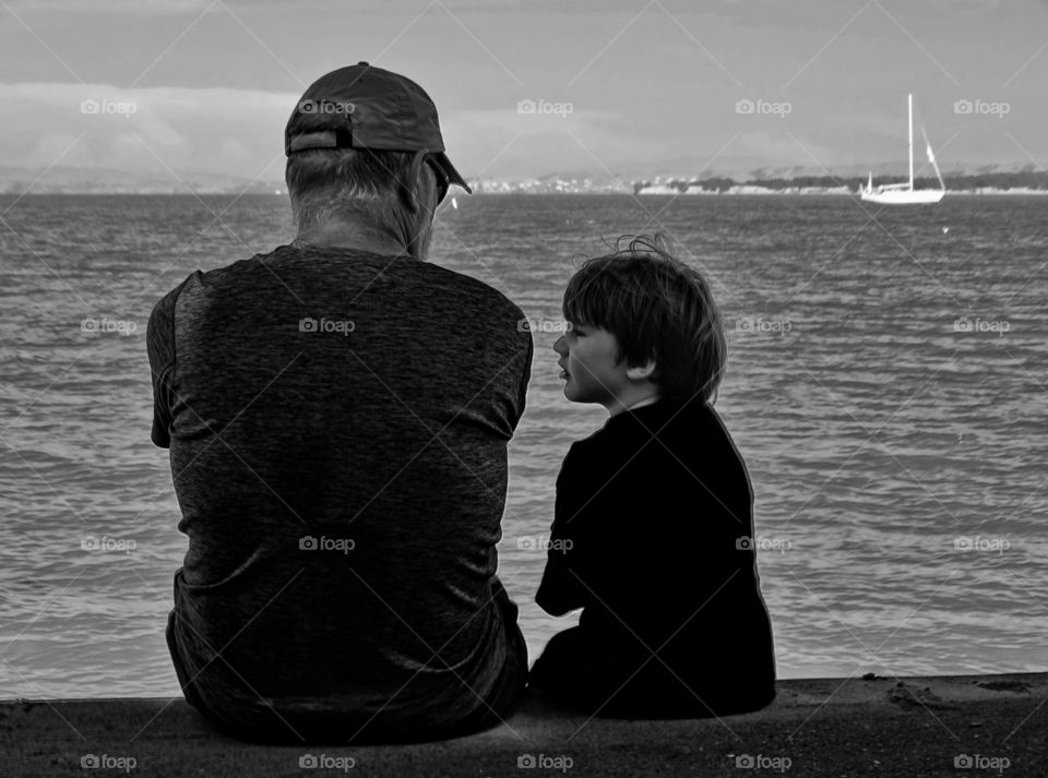 Child With Grandfather. Grandfather With Young Grandson Looking Out On San Francisco Bay
