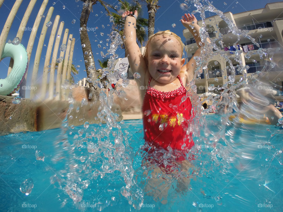 Cute little girl in swimming pool