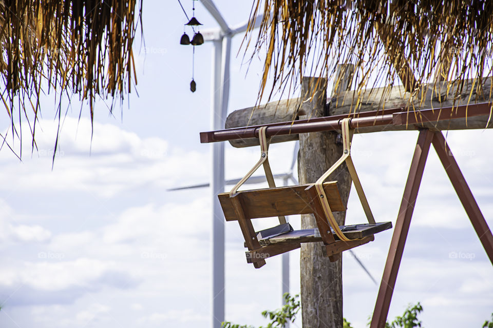 The wooden Ferris wheel and bright blue sky at Windtime Khao kho , Phetchabun in Thailand.