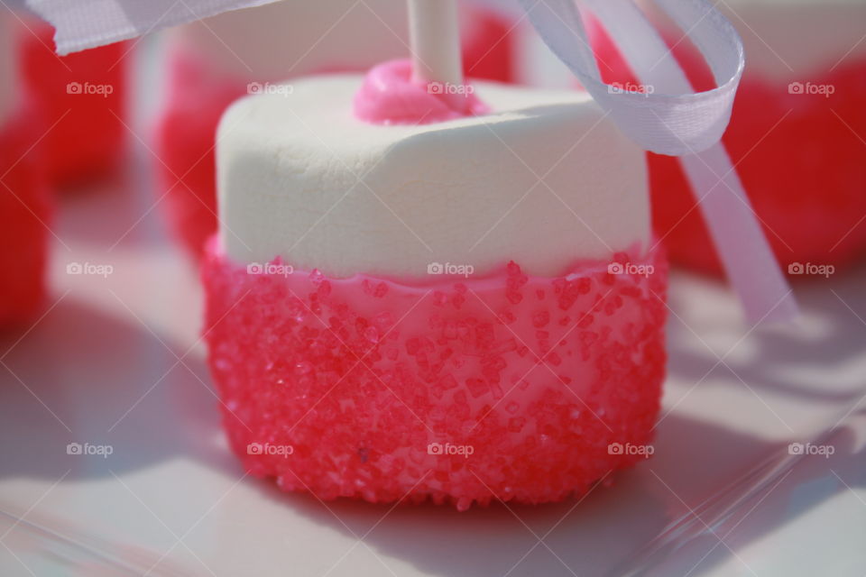 Sweet Pink. Marshmallows dipped in pink colored white chocolate covered in sprinkles. 