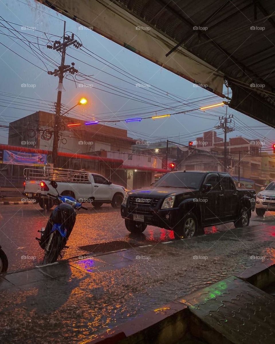 Stormy rainy weather on the road side under shelter in Asia 