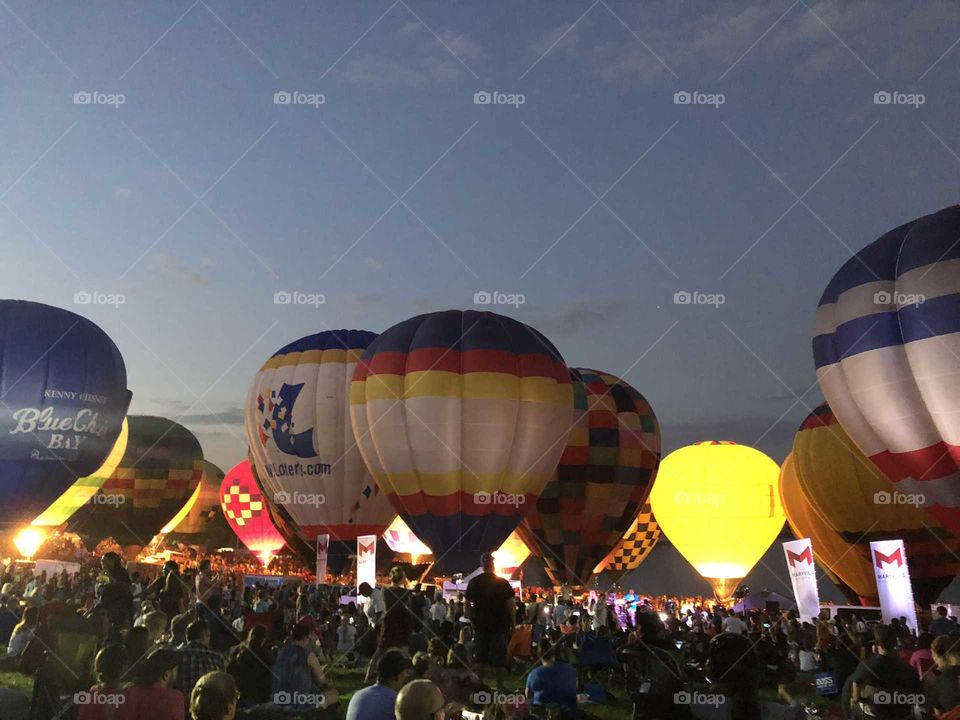 colorful hot air balloons lighting up the night