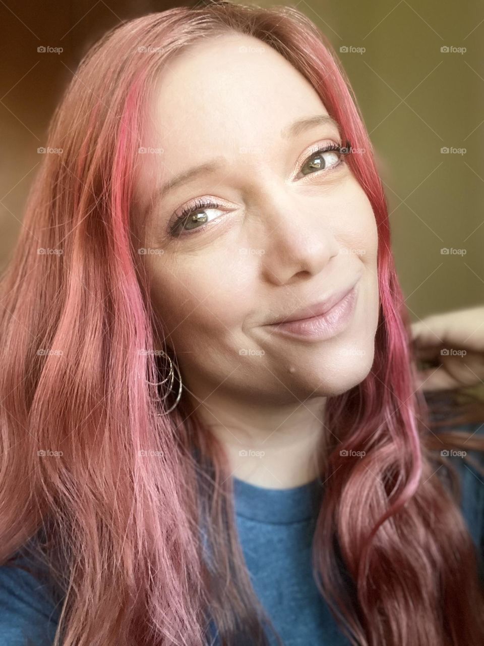 Wavy soft red and rose gold hair