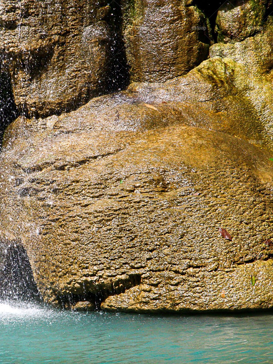 stone. stone in waterfall