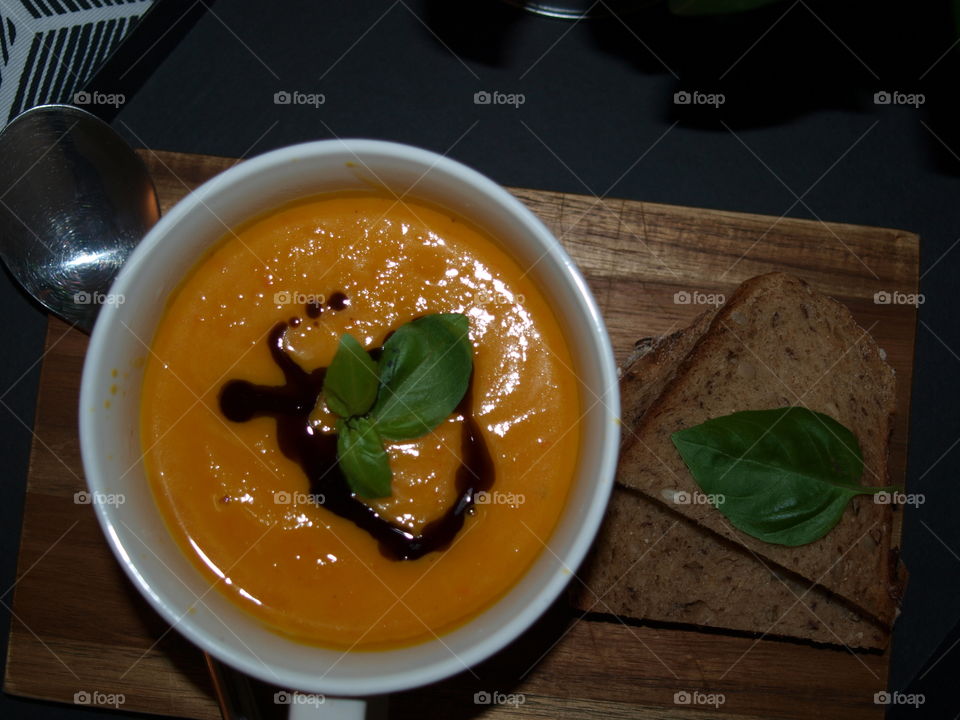 Delicious pumpkin soup with bread