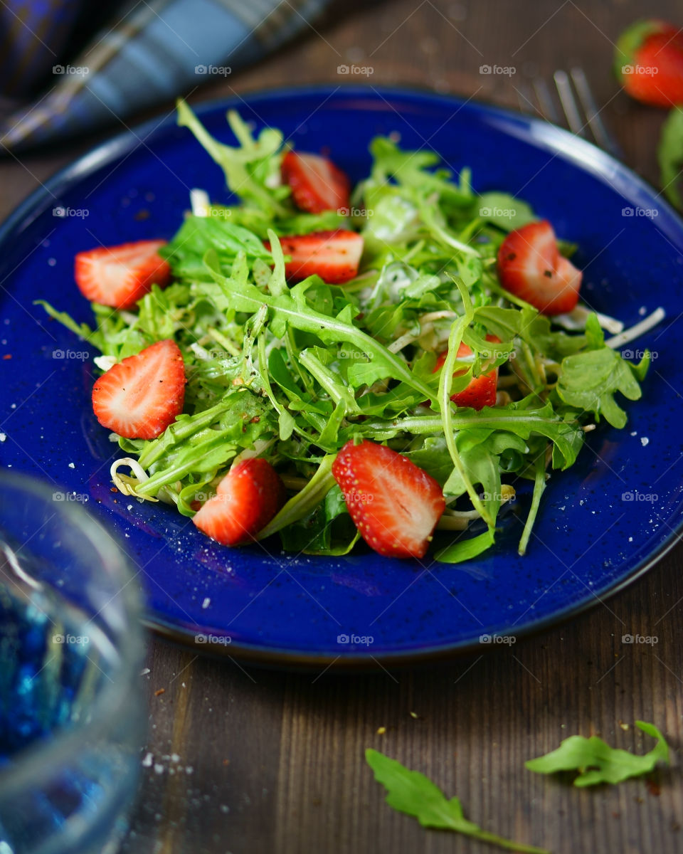 Green salad arugula and strawberry