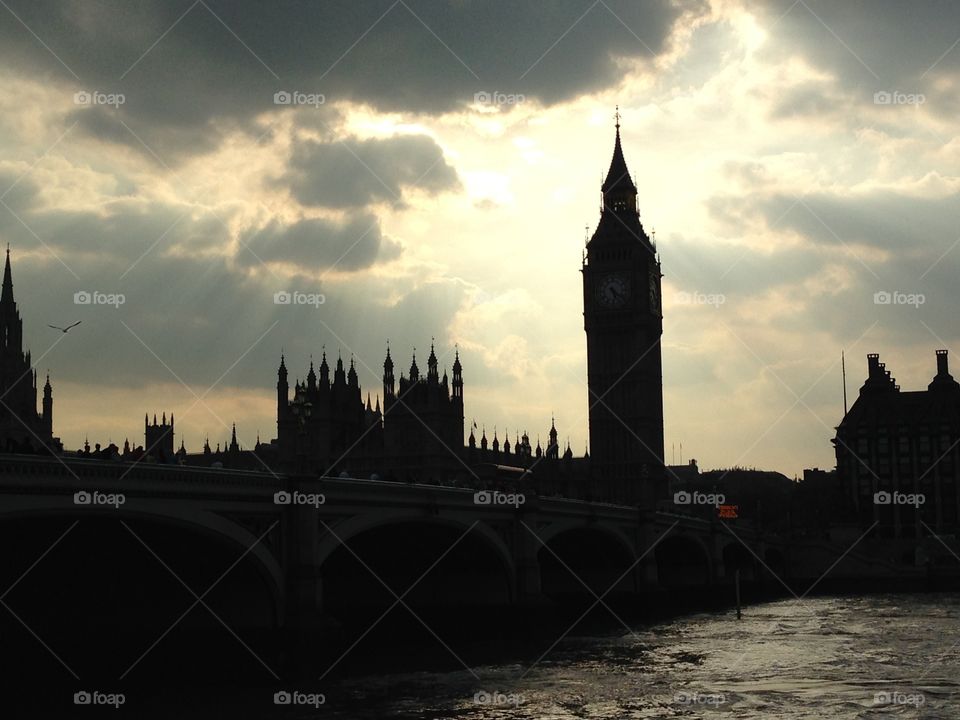 Big Ben tower clock at Westminster Houses of Parliament Thames River