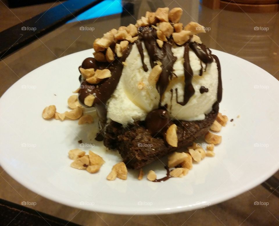 fudge brownie delight!. hot brownie with ice cream and hot fudge drizzled on top with nuts!