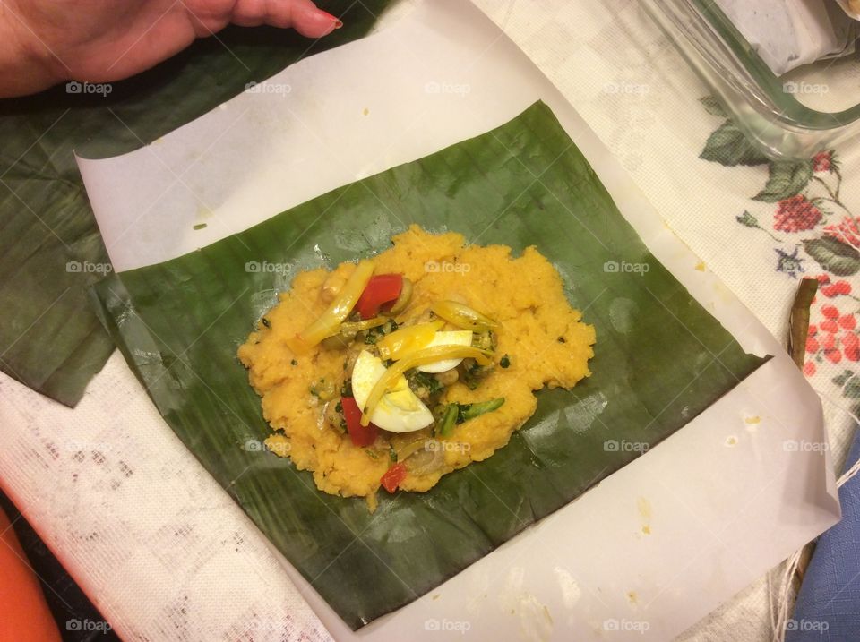 Tamal made with cornmeal, chicken