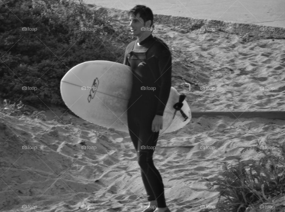 California Surfer Dude. Surfer With A Longboard At A California Beach