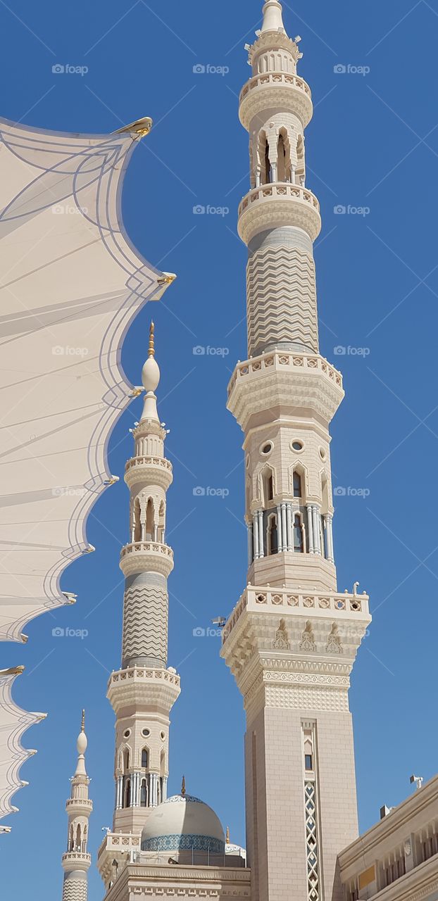 This photo is from outside the Madina Holy Mosque in Saudi Arabia. It is the mosque of Prophet Muhammad (peace be upon him), the Prophet of Islam and muslims. 

The photo can be used in Islamic events and in historical architecture, & worship places.