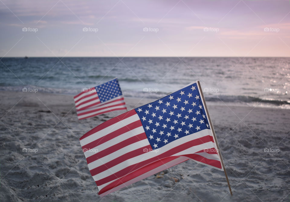 American flag on the beach