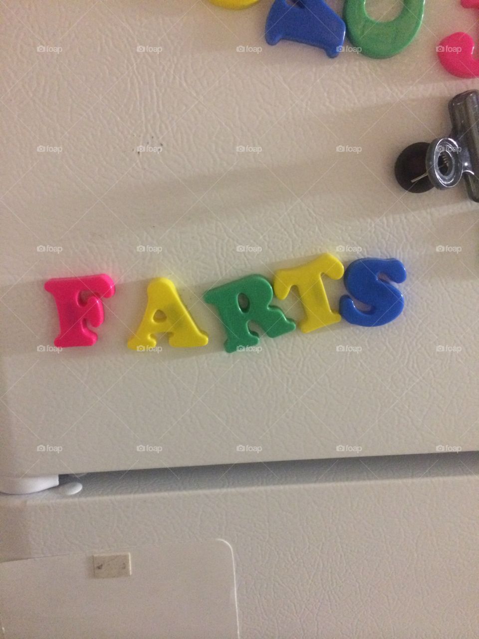 Farts written on the refrigerator with magnets 