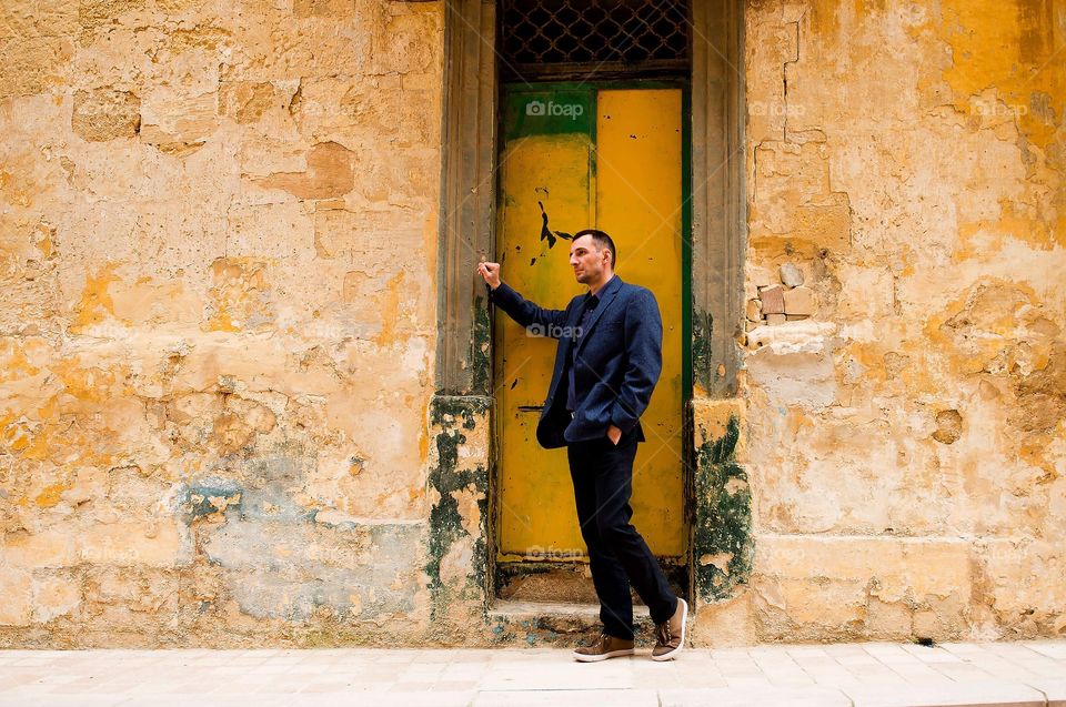 Man and yellow wall in Malta