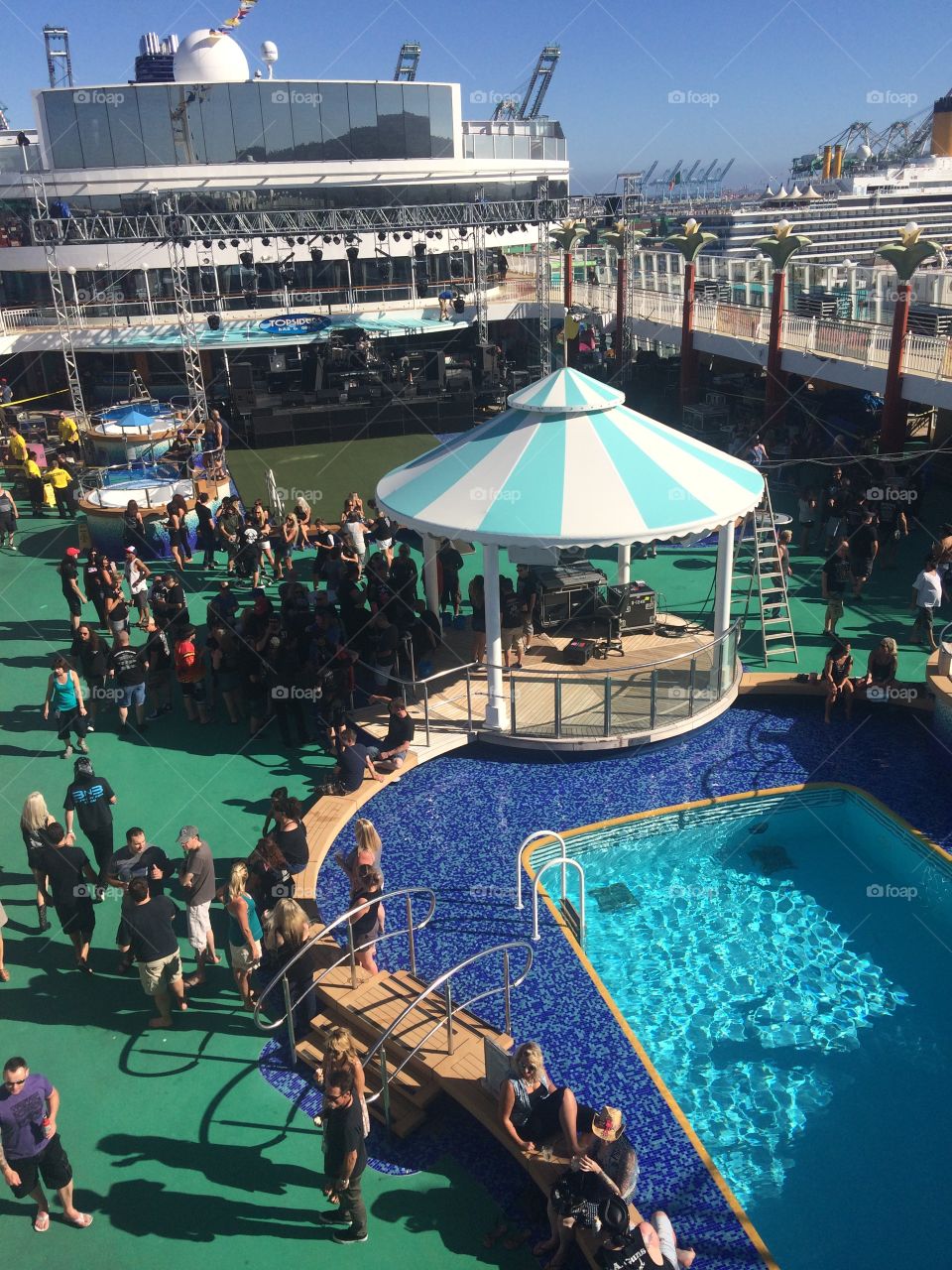 The upper deck of this cruise ship is buzzing with activity: from swimmers in the pool to dancing to the beat of a DJ, everyone was having fun.
