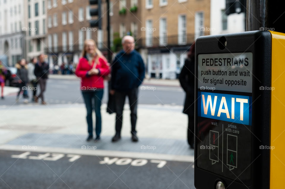 Pedestrians crossing with signals. London. UK.