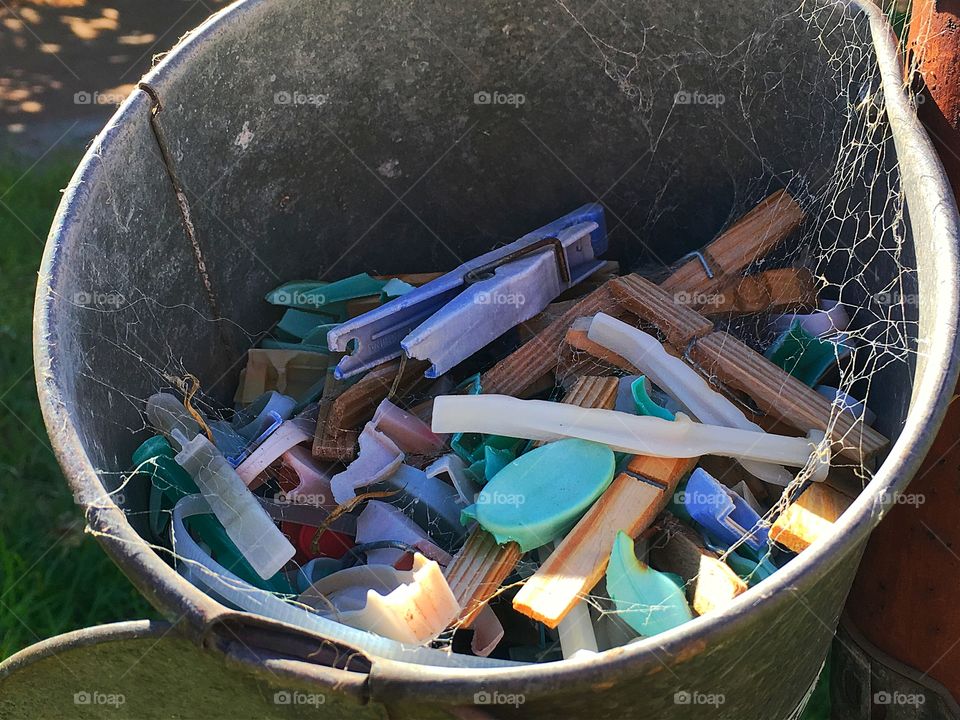 Clothespins pegs in old tin bucket pail