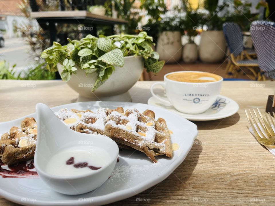 Plants for decorations and coffee with waffles 