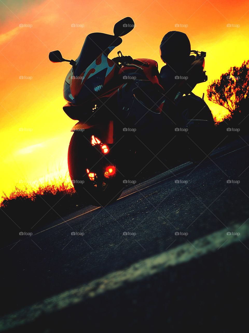 2004 Honda CBR orange and silver flame design sunset in background shadow silhouette 